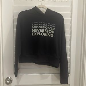 North face black short sweat shirt “never stop exploring “